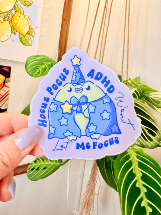 Cute ADHD Focus Frog Sticker Cute Neurodivergent Vinyl Sticker on display with colorful design and playful text.