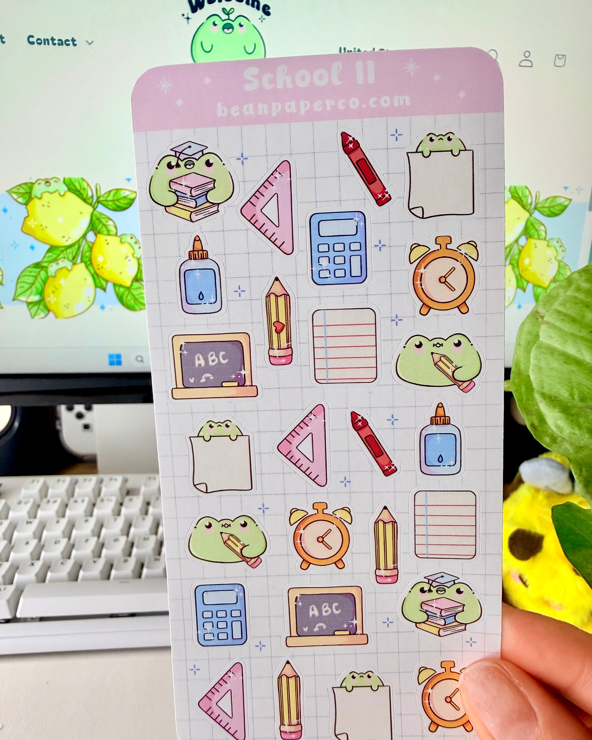 Cute School Frog Sticker Sheet featuring frogs with books and graduation caps, calculators, glue bottles, alarm clocks, chalkboards, and triangle rulers.