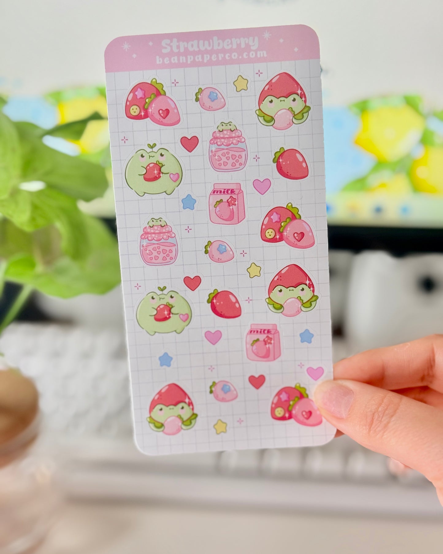 Strawberry Fruit Frog Sticker Sheet featuring cute green frogs, strawberries, strawberry jam jars, milk cartons, hearts, and star accents.