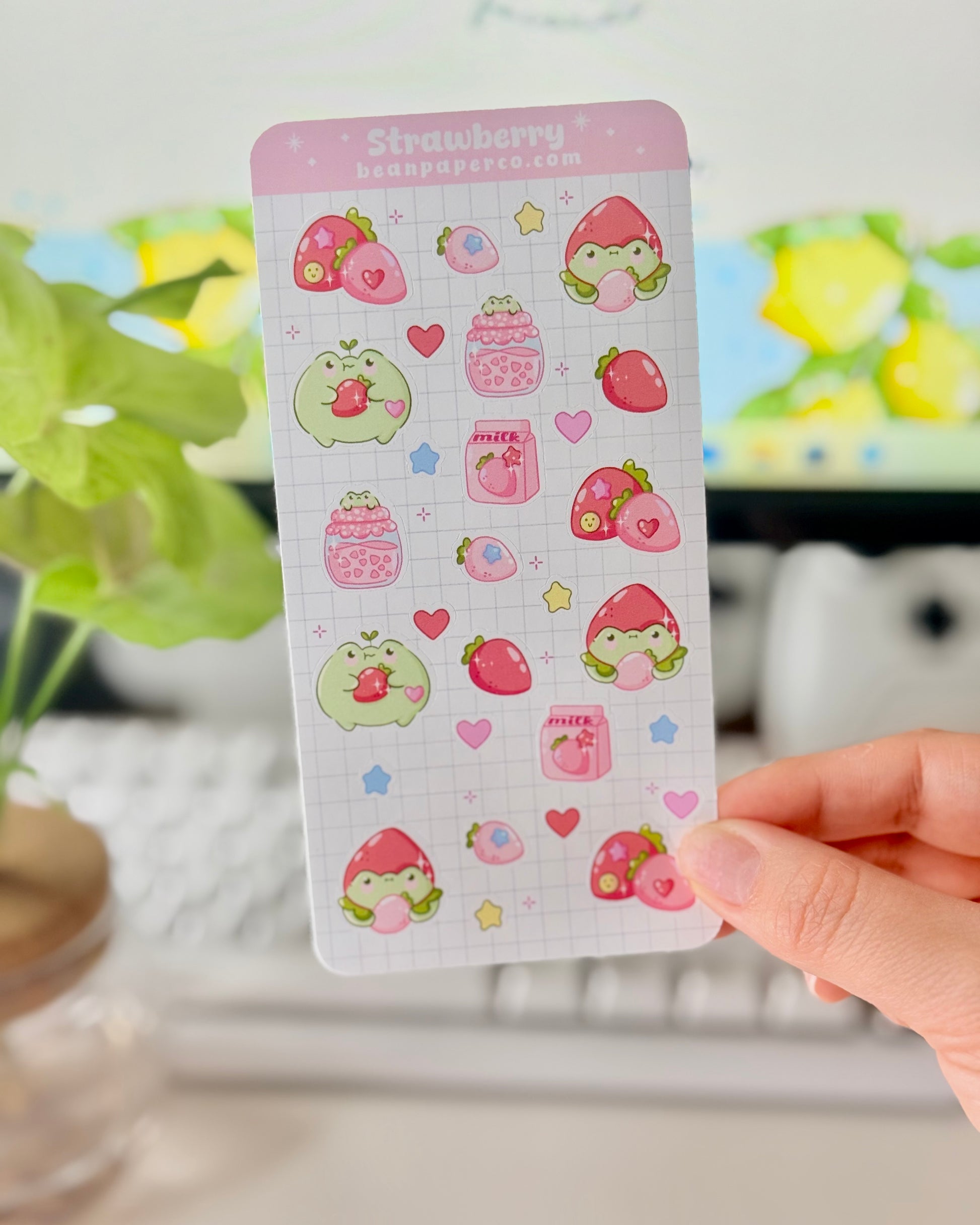 Strawberry Fruit Frog Sticker Sheet featuring cute green frogs, strawberries, strawberry jam jars, milk cartons, hearts, and star accents.