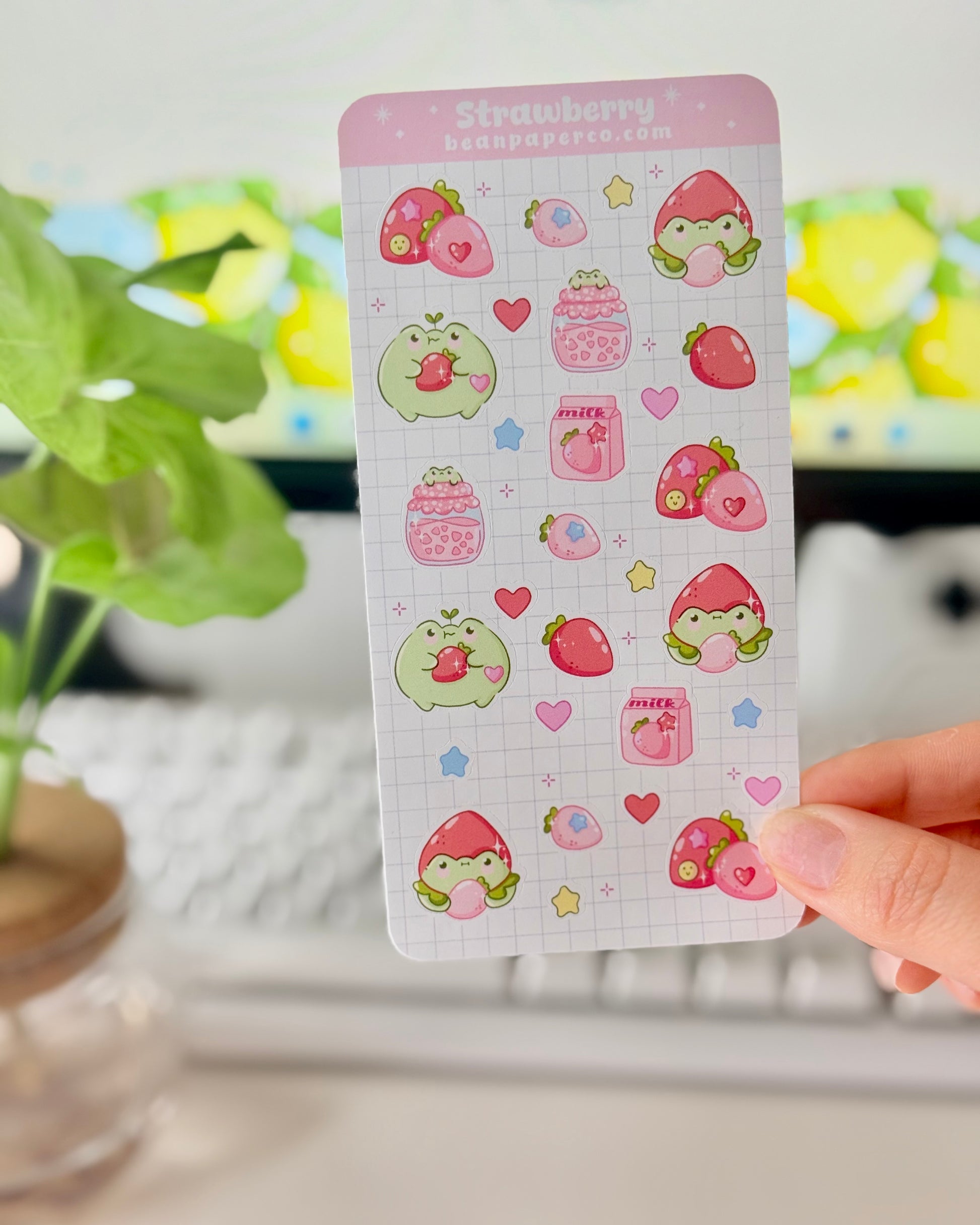 Strawberry Fruit Frog Sticker Sheet featuring cute green frogs, strawberries, strawberry jam jars, milk cartons, hearts, and star accents.
