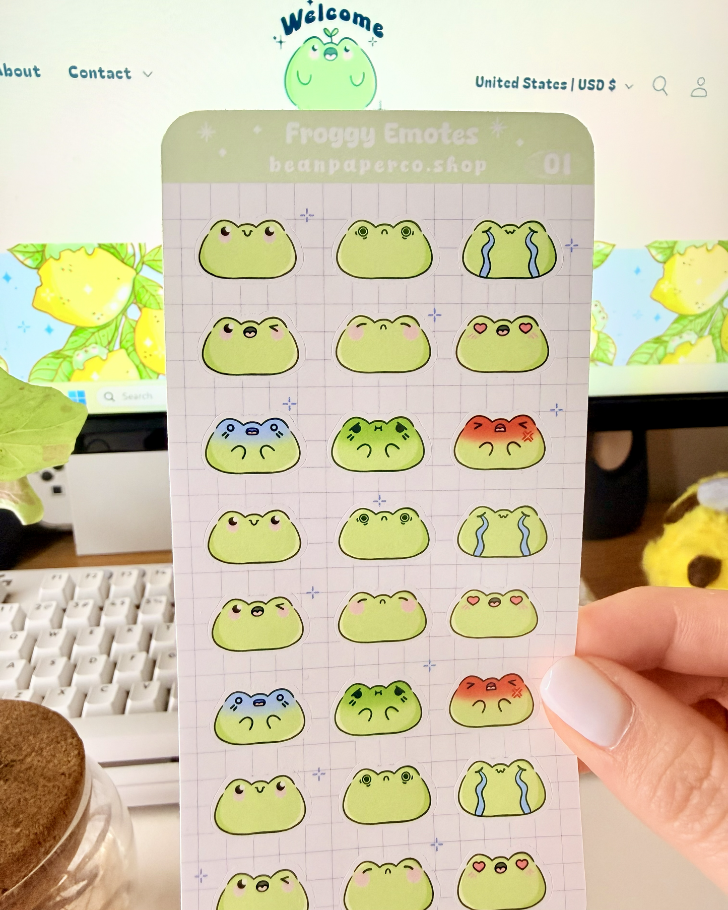 Cute Frog Emote Planner Stickers featuring cute green frog faces with different expressions including happy, blushing, crying, angry, and heart eyes.