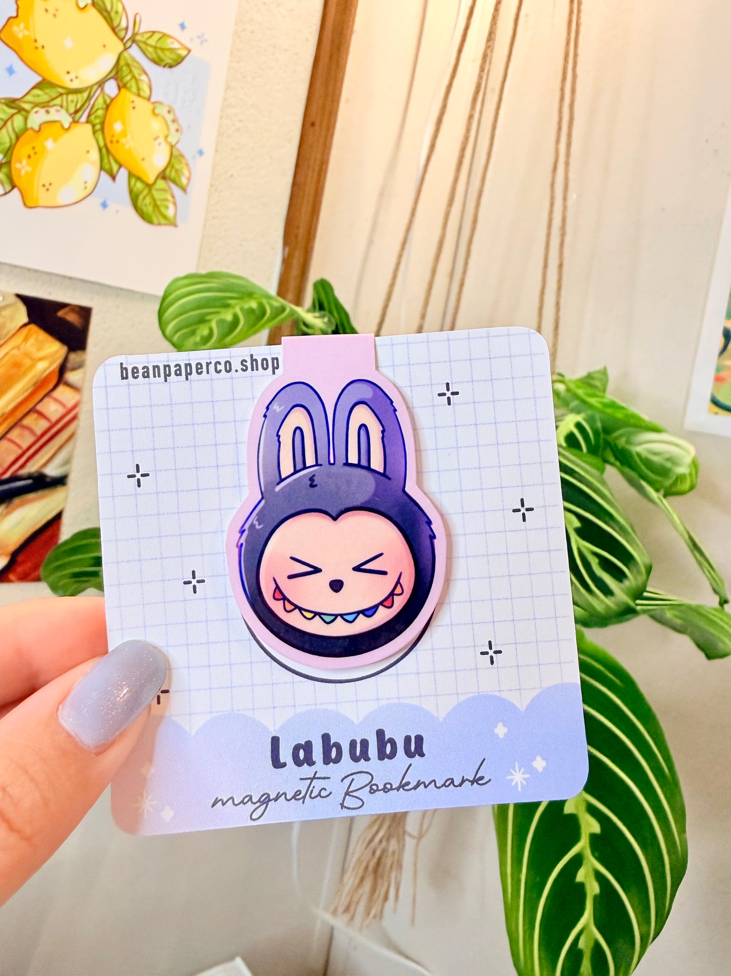 Labubu The Monsters Magnetic Bookmark with a cute bunny design in a colorful setting, ideal for enhancing your reading experience.
