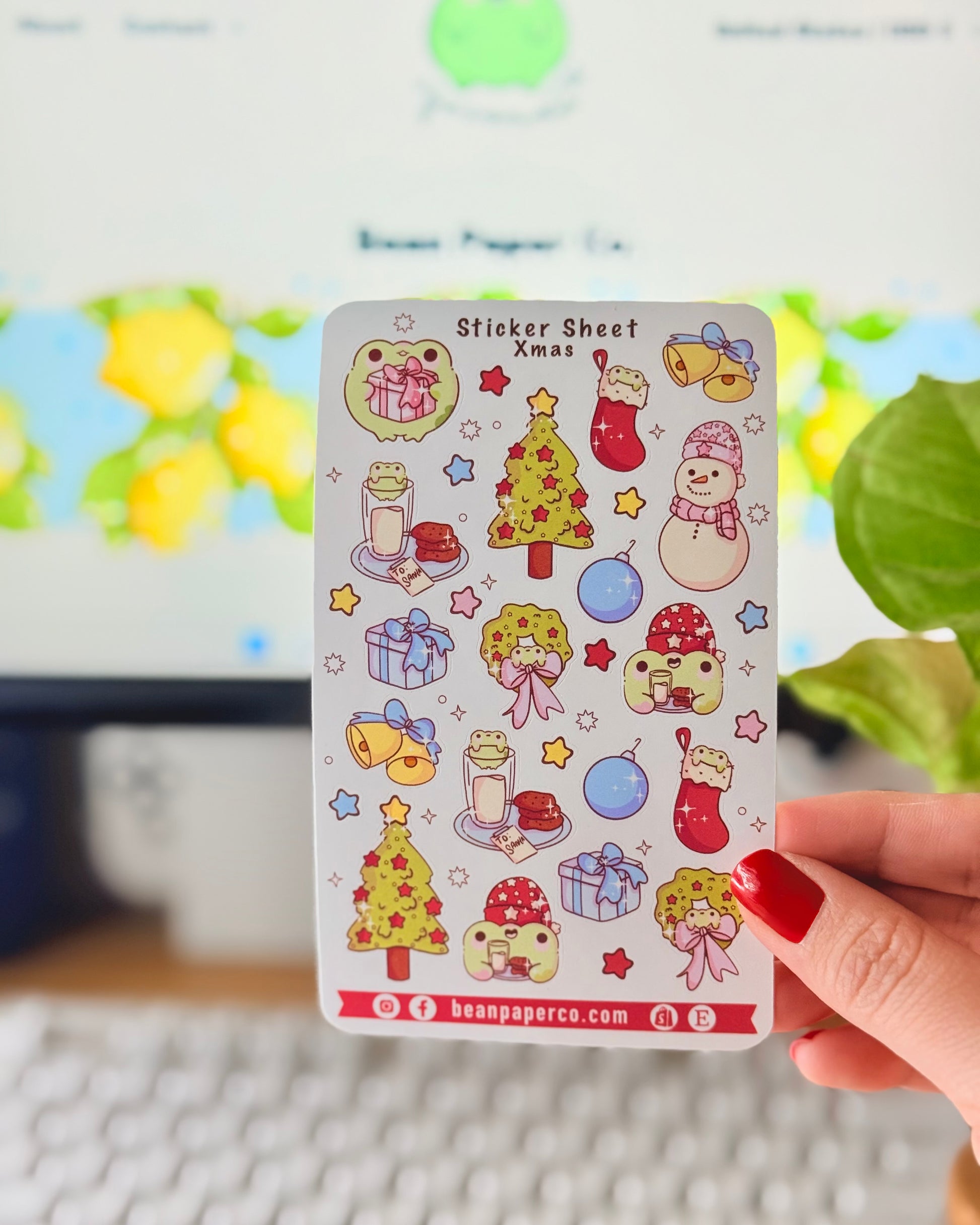 “Christmas frog sticker sheet featuring holiday tree, wreath, stockings, snowman, gifts, and festive frog characters.”