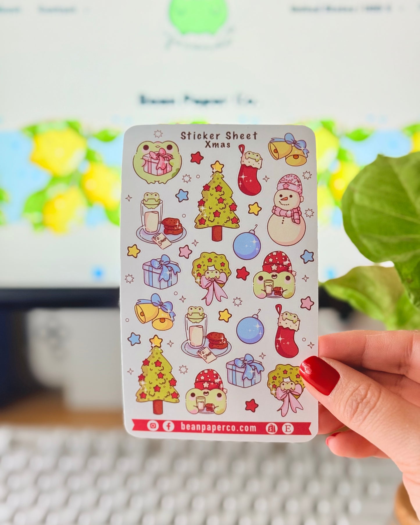 “Christmas frog sticker sheet featuring holiday tree, wreath, stockings, snowman, gifts, and festive frog characters.”