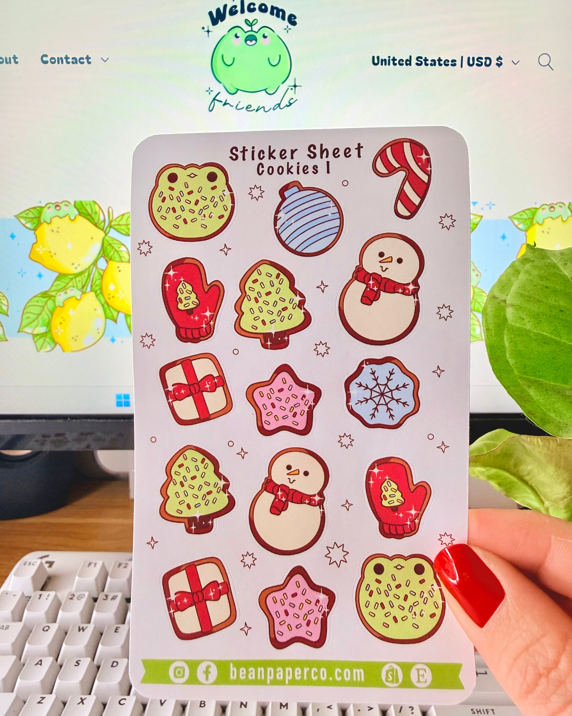 “Cookies-themed winter sticker sheet featuring frog-shaped cookies, candy canes, snowmen, mittens, ornaments, and gift boxes.”