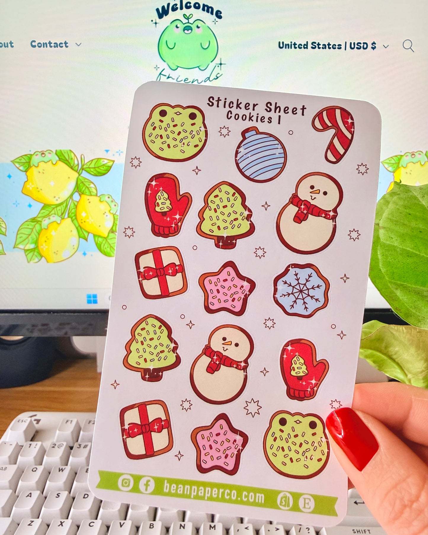 “Cookies-themed winter sticker sheet featuring frog-shaped cookies, candy canes, snowmen, mittens, ornaments, and gift boxes.”