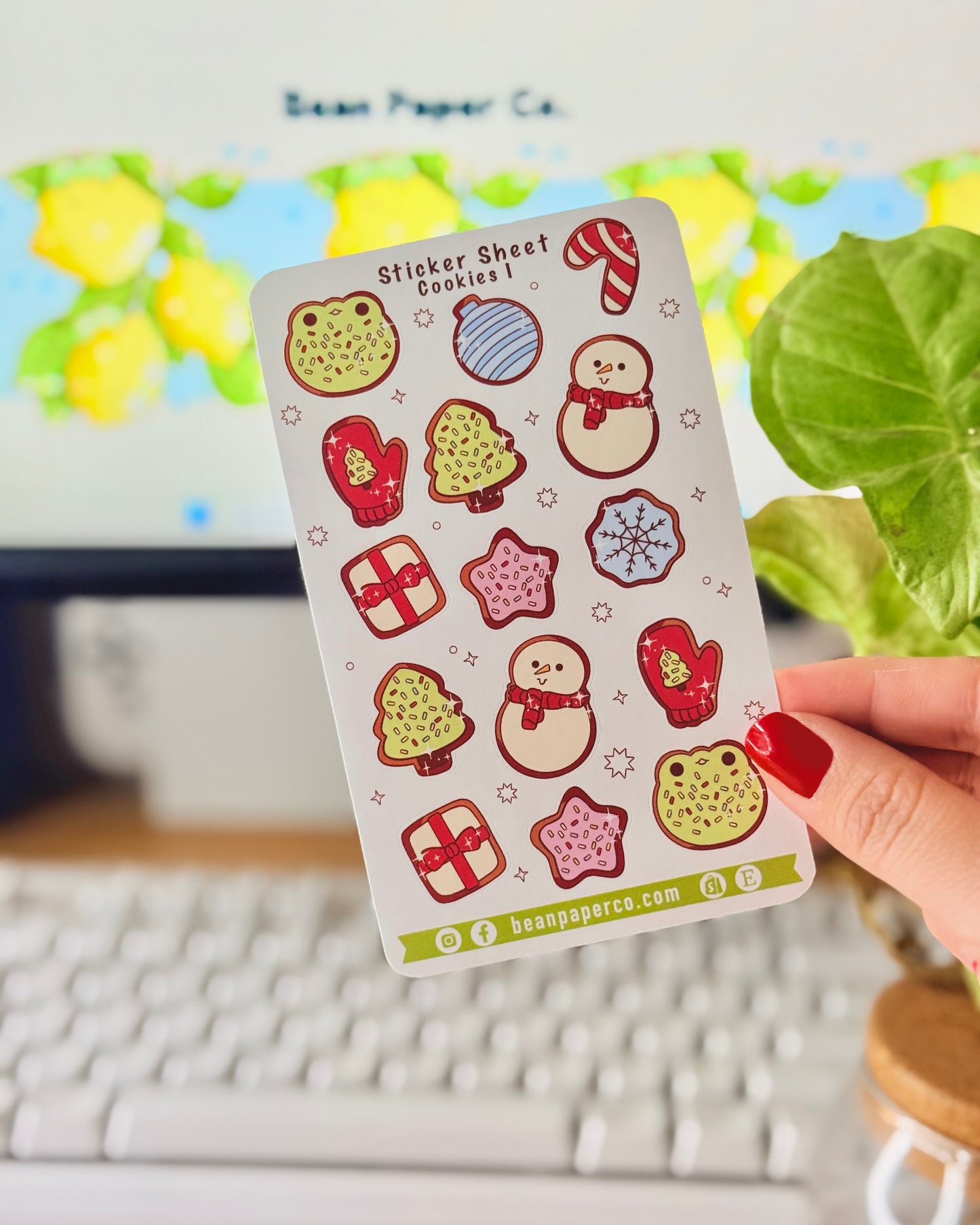 “Cookies-themed winter sticker sheet featuring frog-shaped cookies, candy canes, snowmen, mittens, ornaments, and gift boxes.”